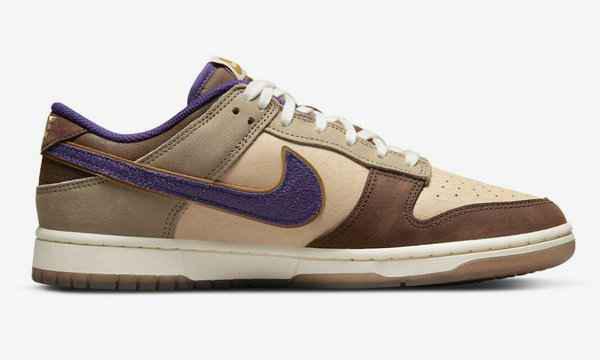 同时鞋舌、鞋领口和鞋头的麂皮运用潮牌信息了深棕与 Nike Swoosh 变形成的鬼脸 Logo 形成对比（大恶魔 Dunk Low 全新“Setsubun”配色鞋款即将来袭）