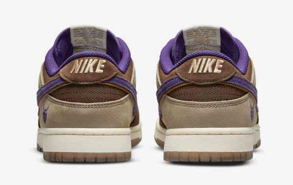 同时鞋舌、鞋领口和鞋头的麂皮运用潮牌信息了深棕与 Nike Swoosh 变形成的鬼脸 Logo 形成对比（大恶魔 Dunk Low 全新“Setsubun”配色鞋款即将来袭）
